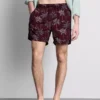 Broderade badshorts med palmträd