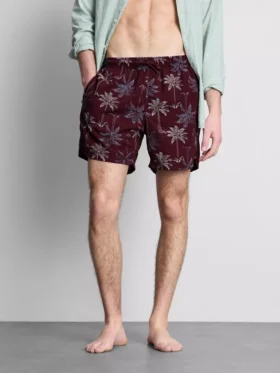 Broderade badshorts med palmträd