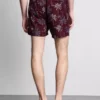 Broderade badshorts med palmträd