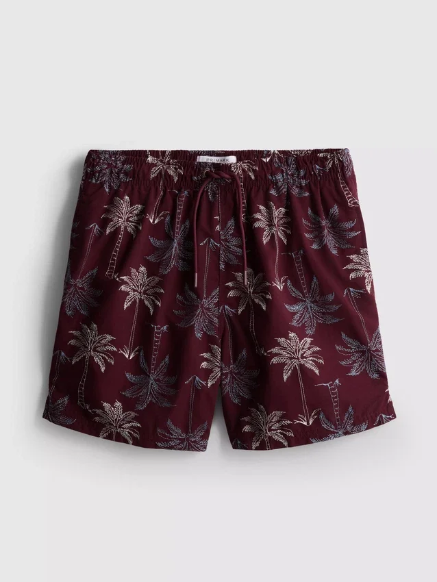 Broderade badshorts med palmträd