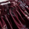 Broderade badshorts med palmträd