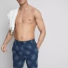 Broderade badshorts med solmotiv