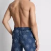 Broderade badshorts med solmotiv