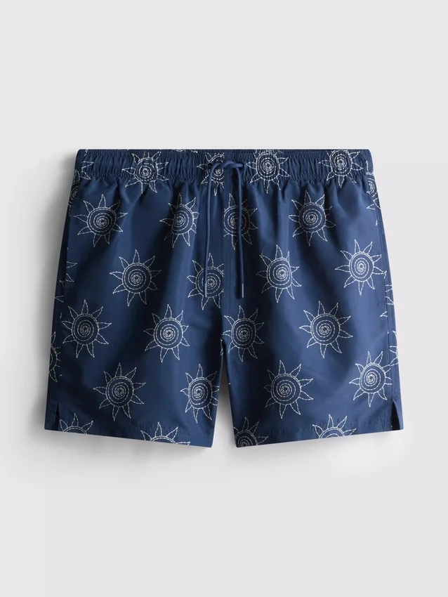 Broderade badshorts med solmotiv