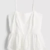 Cami-top i bomull med broderad peplum-kant