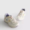 Chunky sneakers med blommiga detaljer