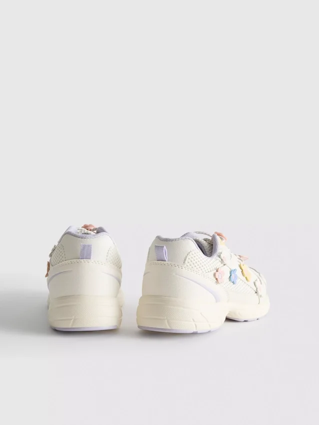 Chunky sneakers med blommiga detaljer