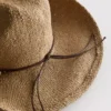 Cowboyhatt i strå med kantband