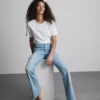 Flared-jeans i bomullsdenim med medelhög midja