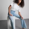 Flared-jeans i bomullsdenim med medelhög midja