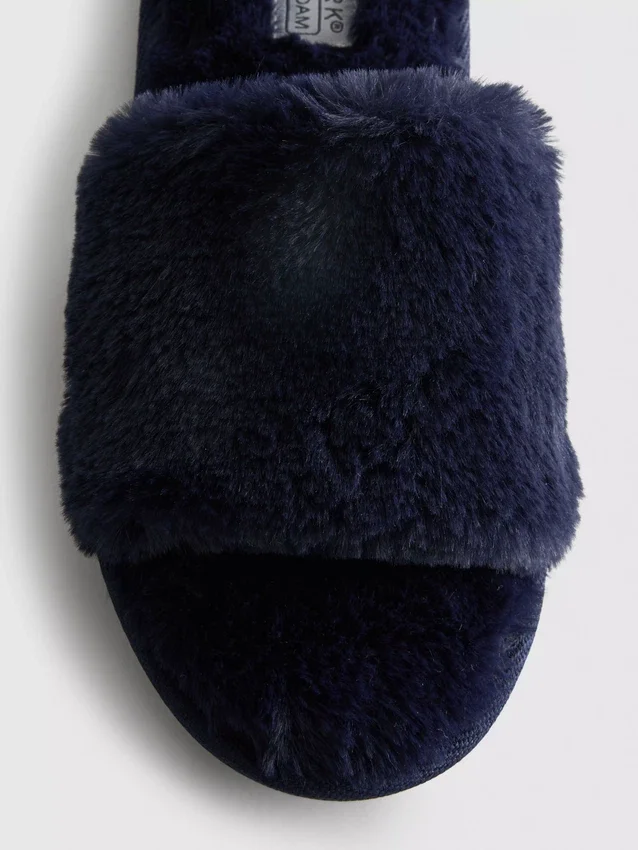 Fluffiga tofflor med korsband