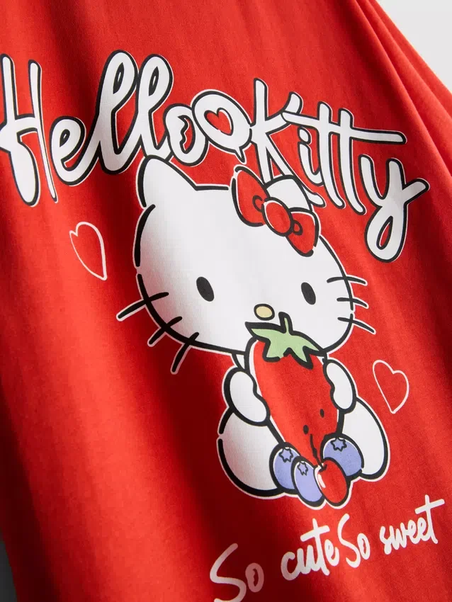 Hello Kitty-T-shirt i bomull med avslappnad passform och jordgubbsmotiv