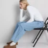 Högmidjade, avsmalnande jeans i bomullsdenim