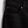 Högmidjade, avsmalnande jeans i bomullsdenim