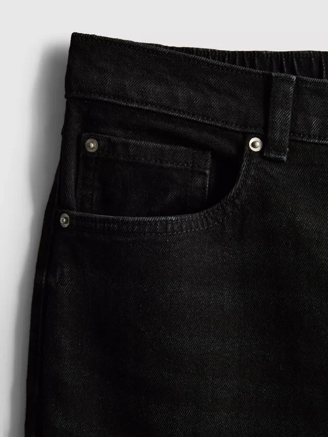 Högmidjade, avsmalnande jeans i bomullsdenim