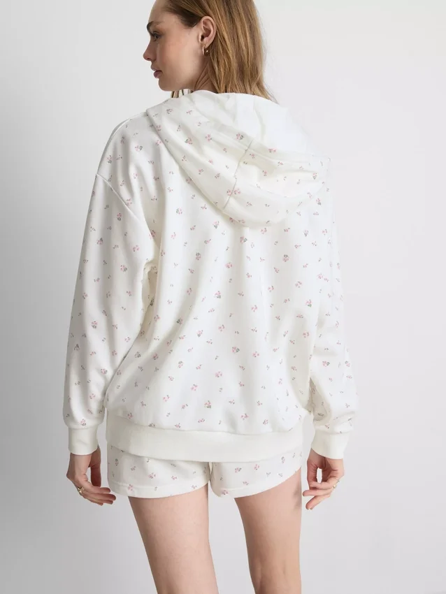 Huvtröja med dragkedja i bomullsrik blommig design