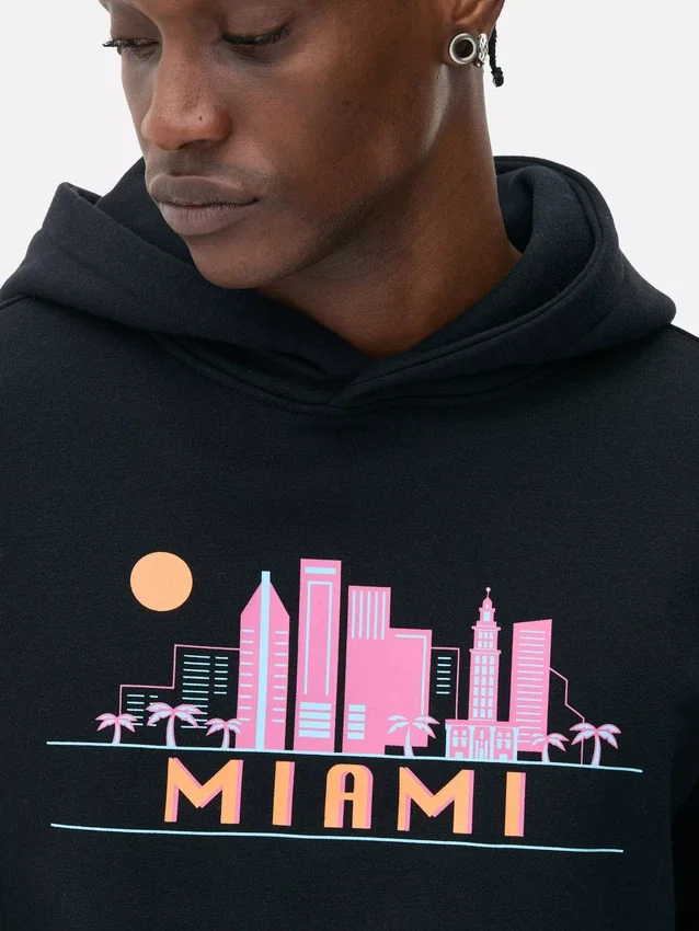 Huvtröja med Miami-silhuett