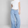 Jeans i bomullsdenim med medelhög midja och vida ben