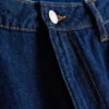 Jeans i bomullsdenim med medelhög midja och vida ben
