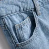 Jeans i bomullsdenim med medelhög midja och vida ben