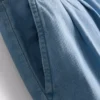 Jeans i bomullsdenim med veck och vida ben