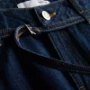 Jeans med medelhög midja, bälten och vida ben