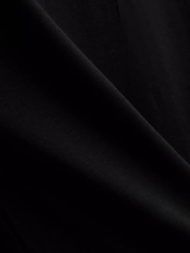 Kort, ärmlös T-shirt med axelvaddar