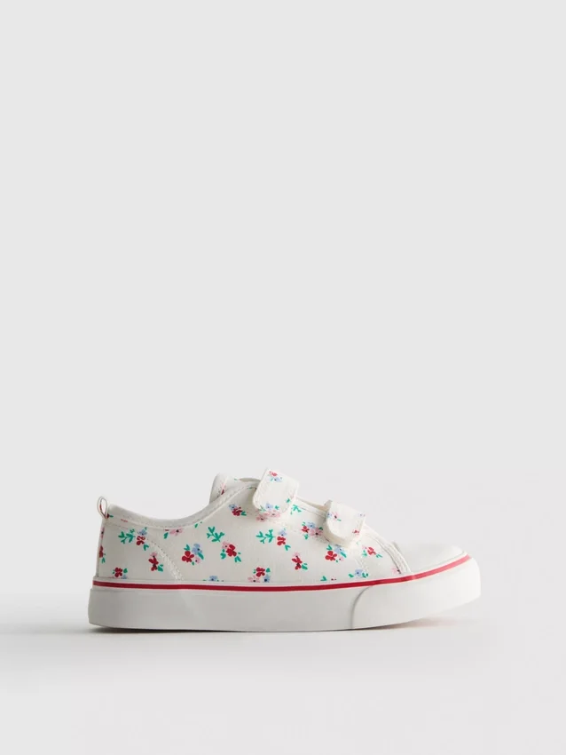 Låga sneakers i canvas med blommönster