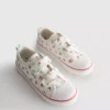 Låga sneakers i canvas med blommönster