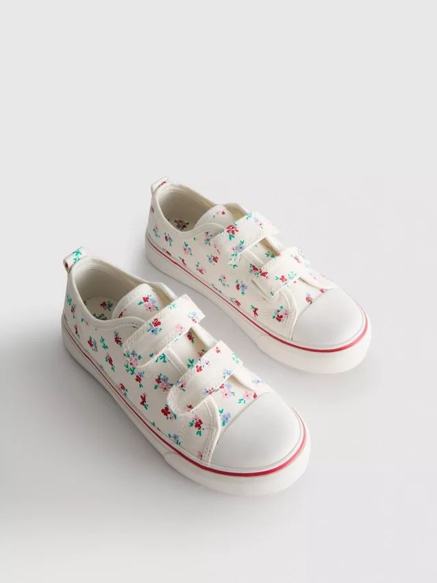 Låga sneakers i canvas med blommönster