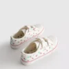 Låga sneakers i canvas med blommönster