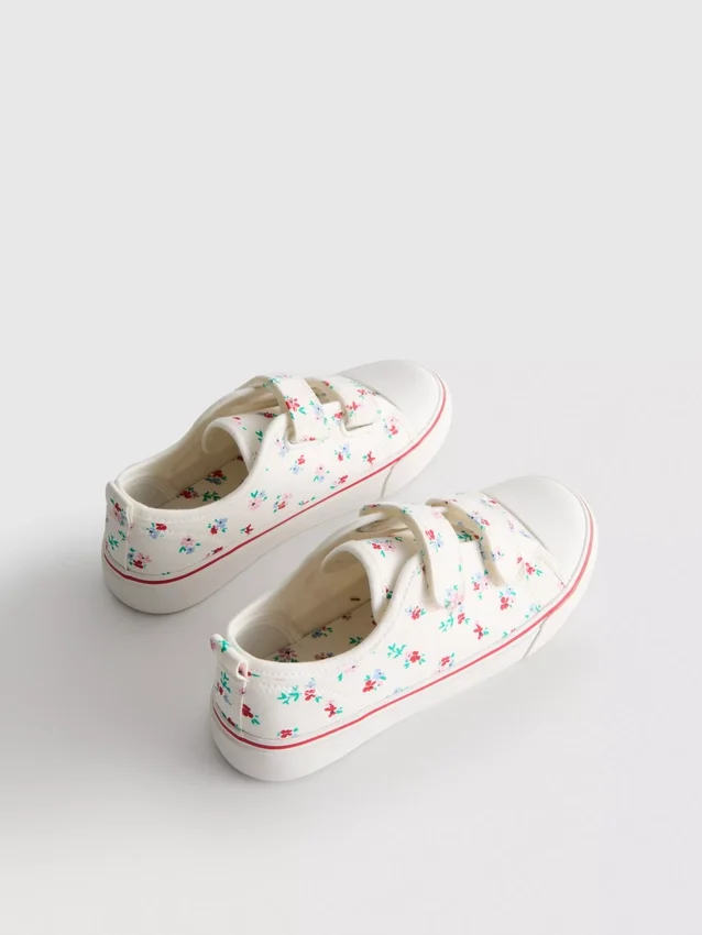 Låga sneakers i canvas med blommönster