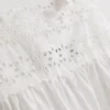 Linne med broderad insats