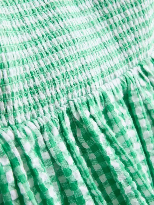 Miniklänning i bomullsgingham med bandeau-top