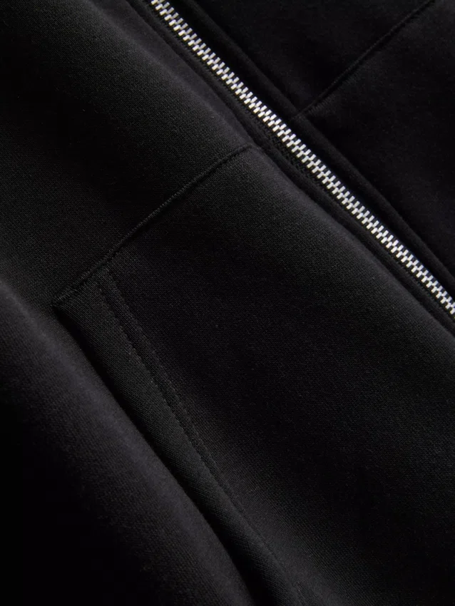 Oumbärlig hoodie med dragkedja