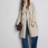 Oumbärlig trenchcoat med bälte
