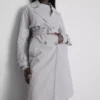 Oumbärlig trenchcoat med bälte