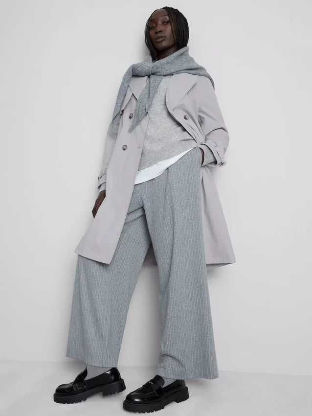 Oumbärlig trenchcoat med bälte