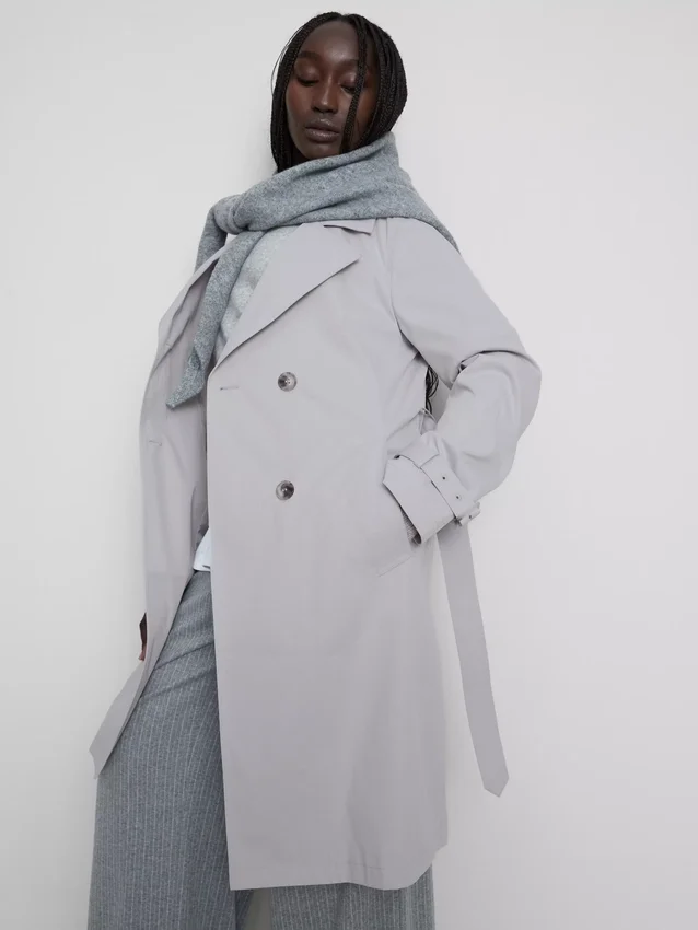 Oumbärlig trenchcoat med bälte