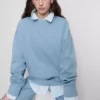 Oversized-tröja med neddragna axlar