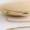 Paula Echevarría metallisk oval crossbody-väska