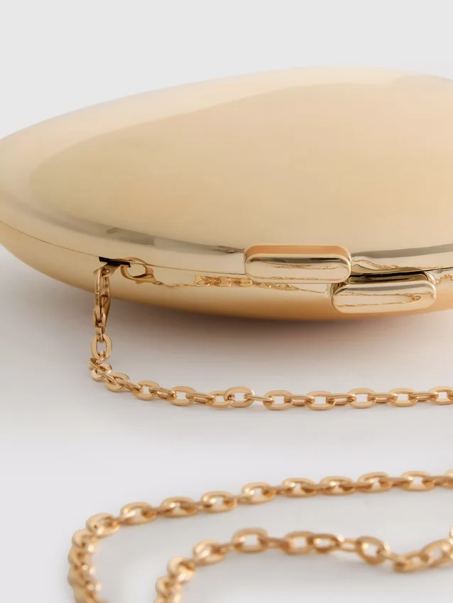 Paula Echevarría metallisk oval crossbody-väska