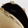 Paula Echevarría metallisk oval crossbody-väska