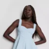 Peplum-top i crepe med hjärtformad halsringning