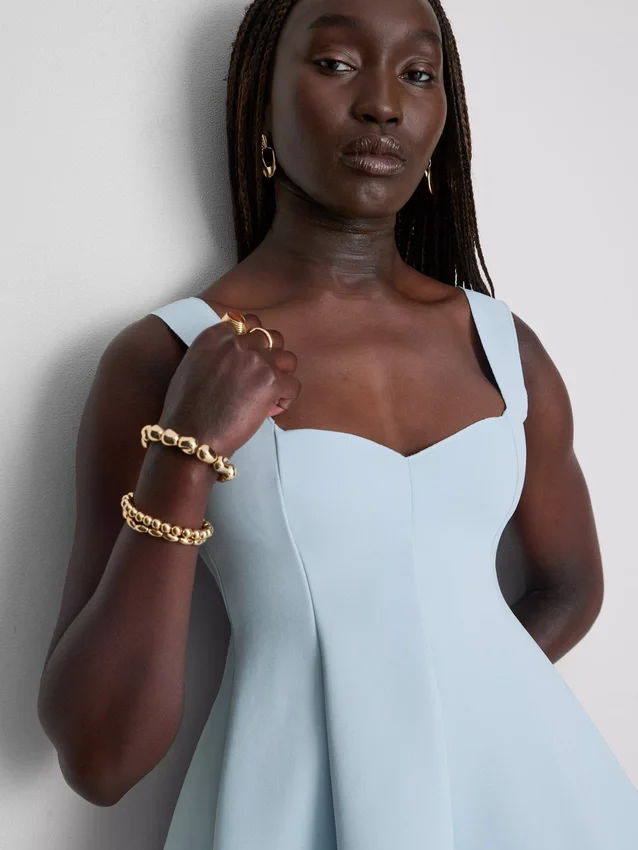 Peplum-top i crepe med hjärtformad halsringning