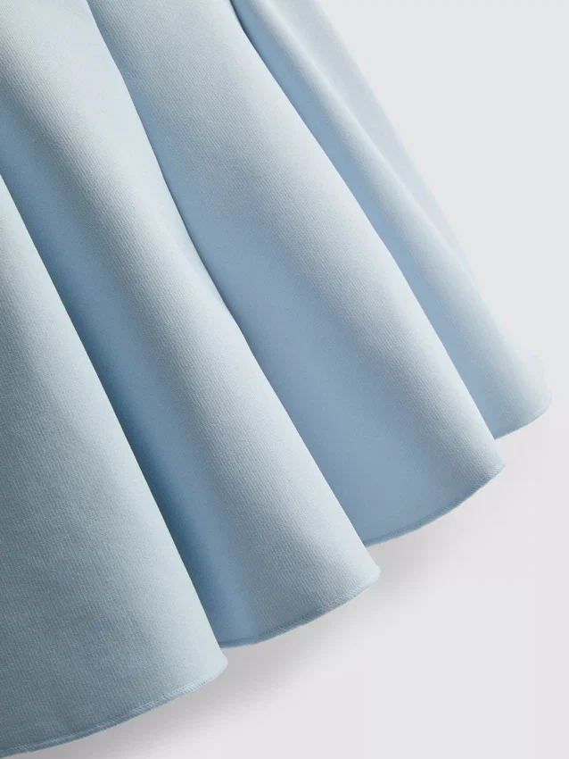 Peplum-top i crepe med hjärtformad halsringning
