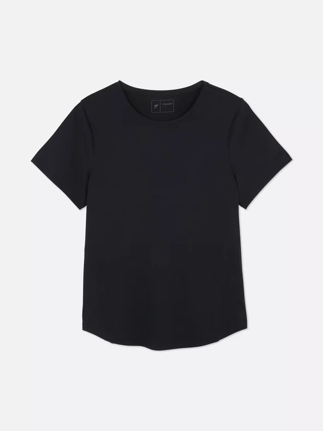 Performance-T-shirt med rundad nederkant