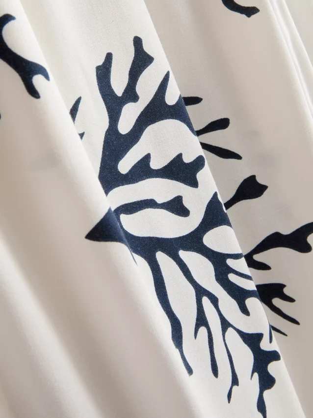 Pyjamasbyxor med vid ben och korallmönster