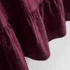 Randig linne med peplum-kant