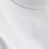 Ärmlös T-shirt med vadderade axlar